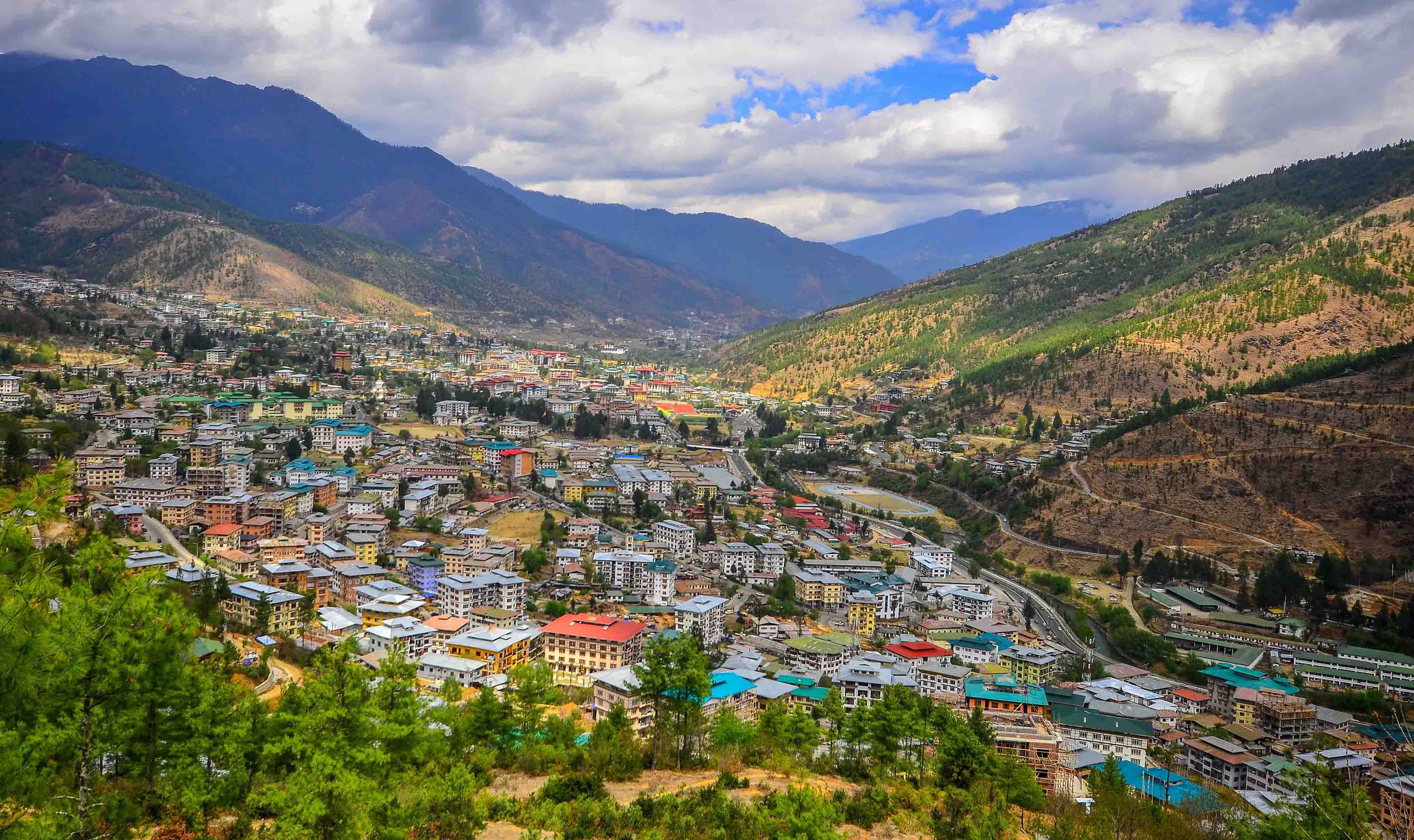 https://www.bhutanpeacefultour.com/wp-content/uploads/2018/11/Thimphu-City-Image-Main.jpg?utm_source=chatgpt.com